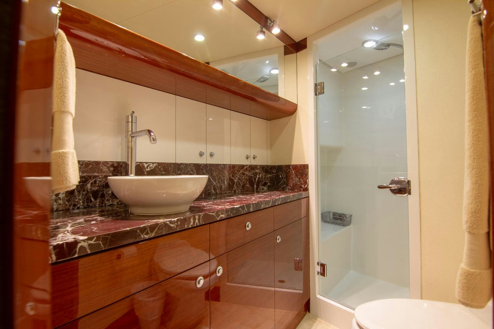 a bathroom with a sink and a mirror aboard BRAVO Yacht for Sale