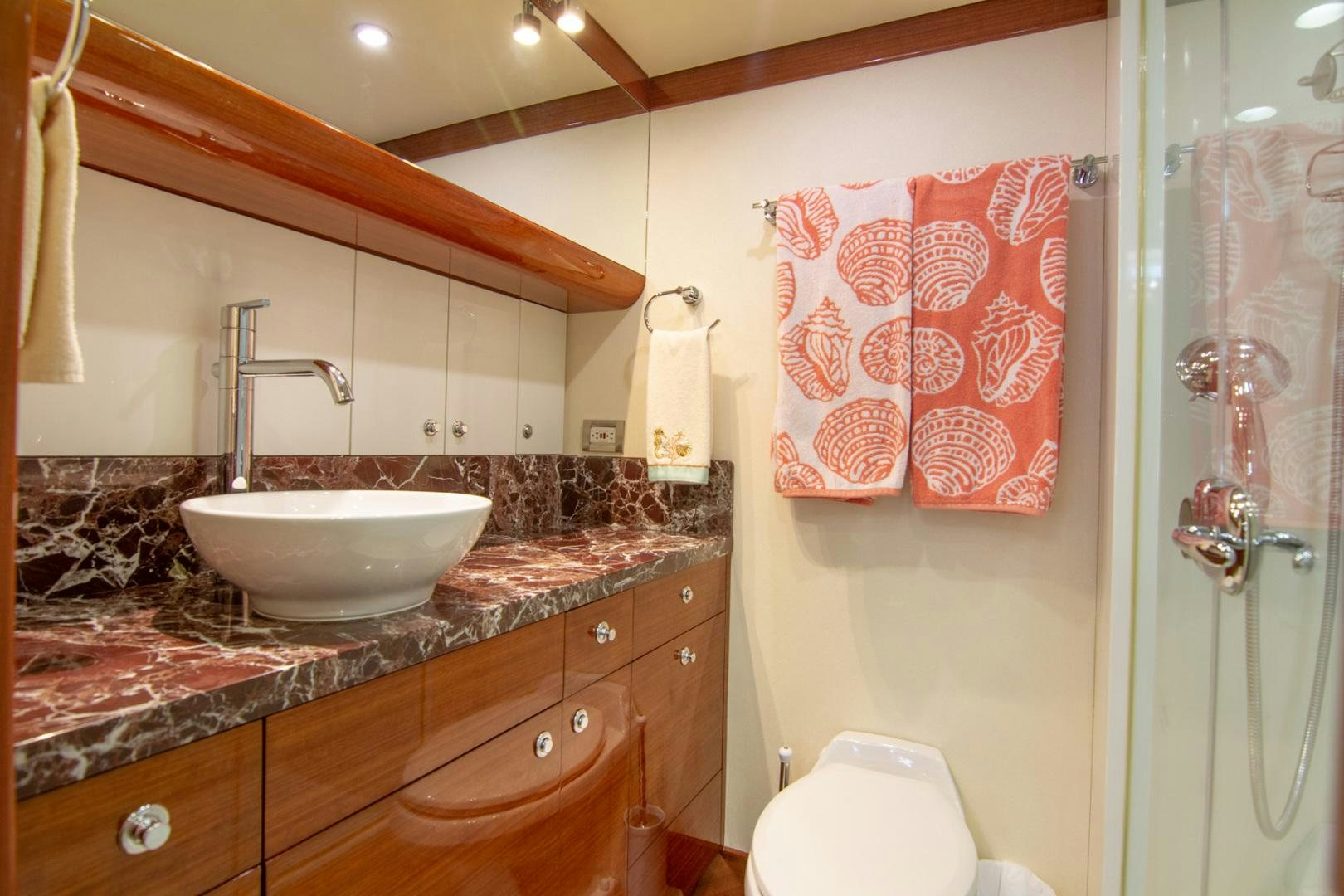a bathroom with a sink and a toilet aboard BRAVO Yacht for Sale