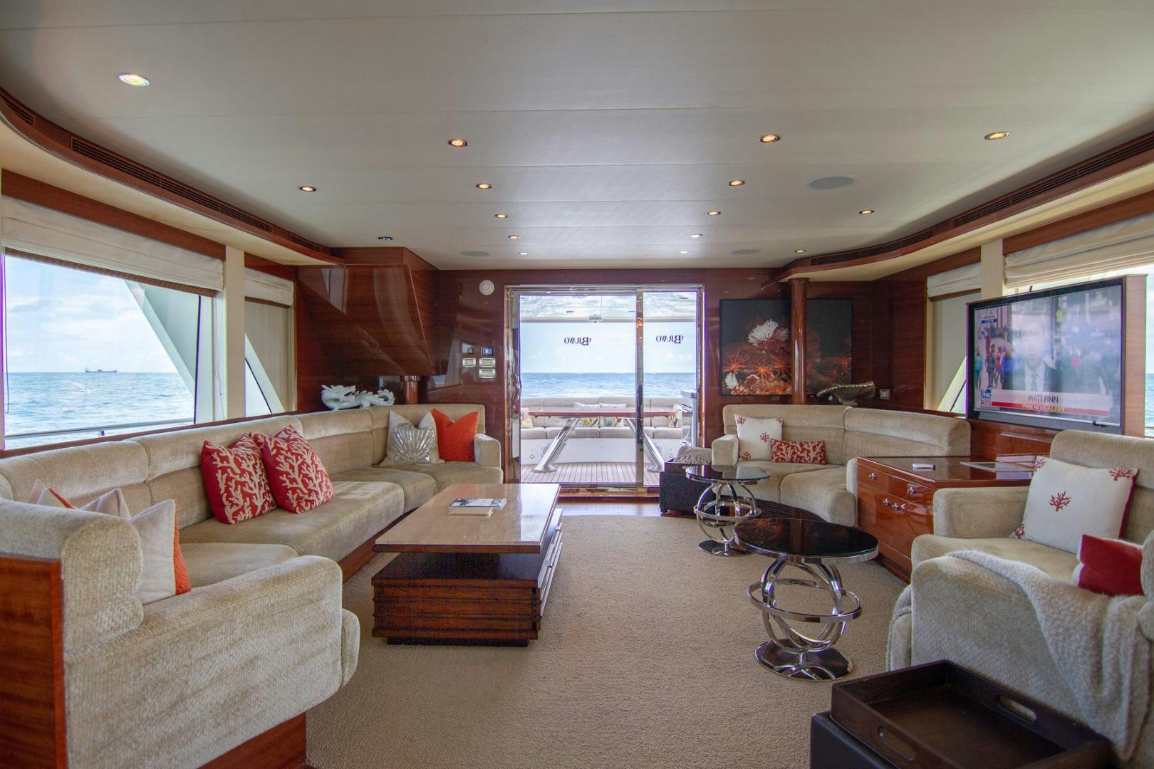 a living room with a large window aboard BRAVO Yacht for Sale