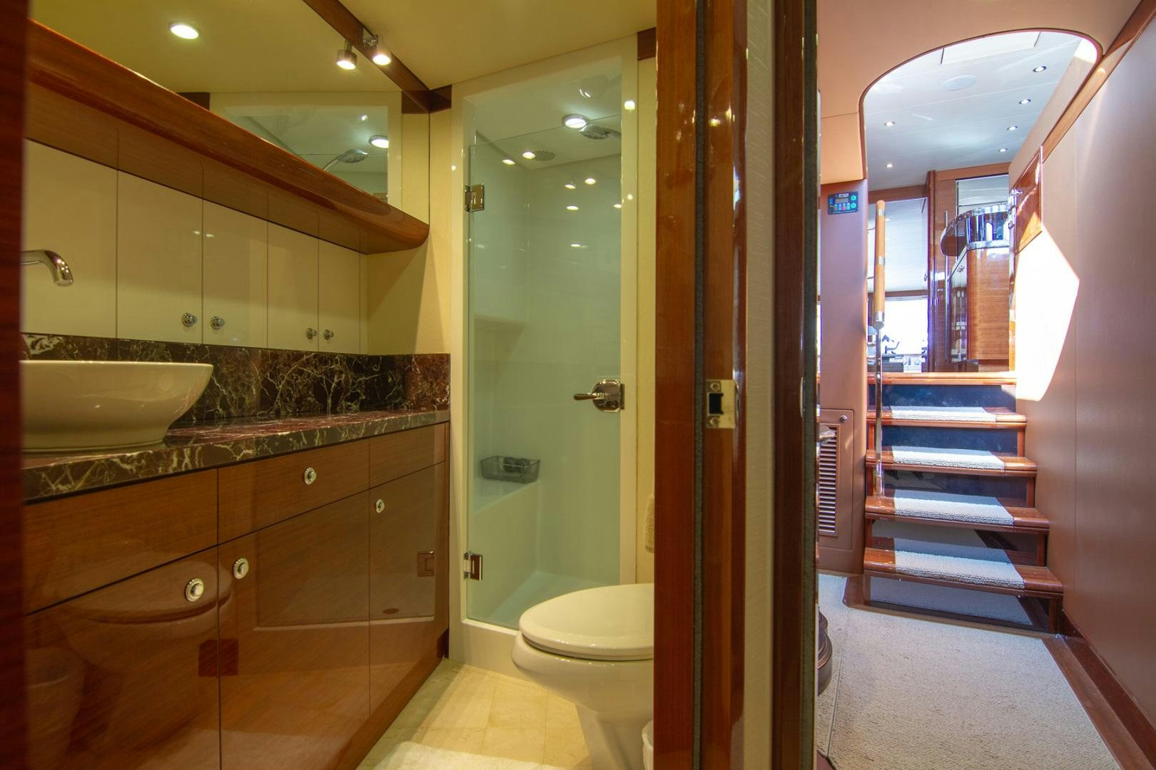 a bathroom with a large mirror aboard BRAVO Yacht for Sale