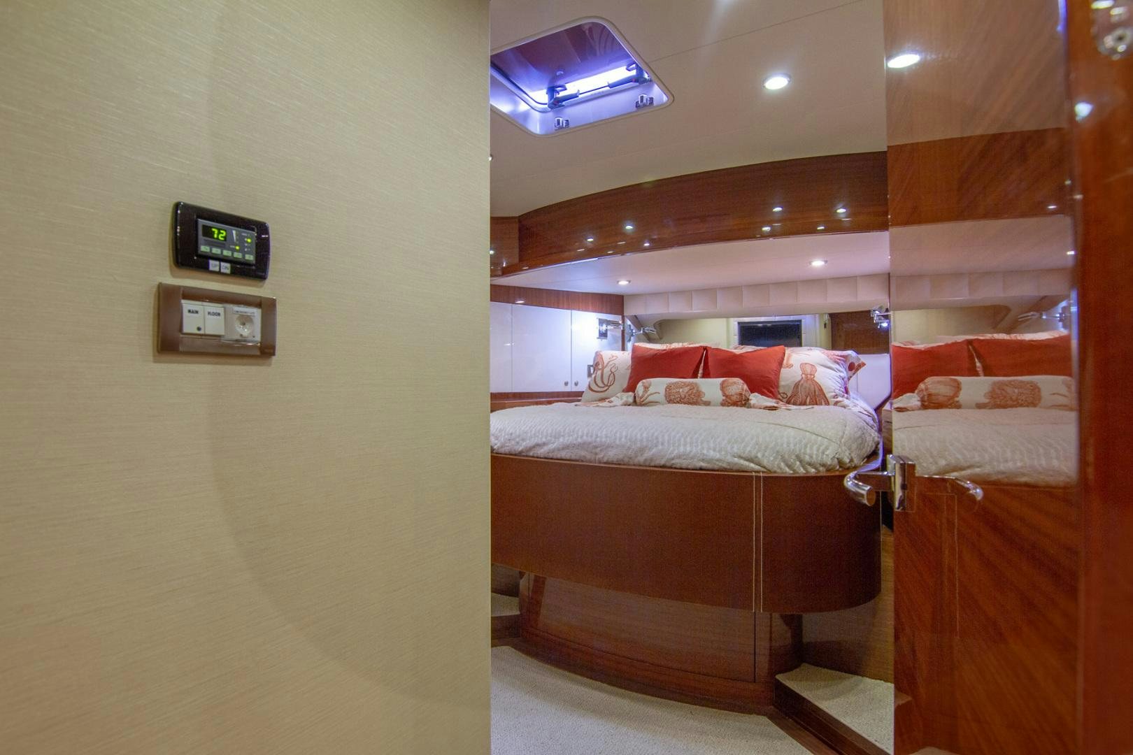 a bedroom with a bed and a television aboard BRAVO Yacht for Sale