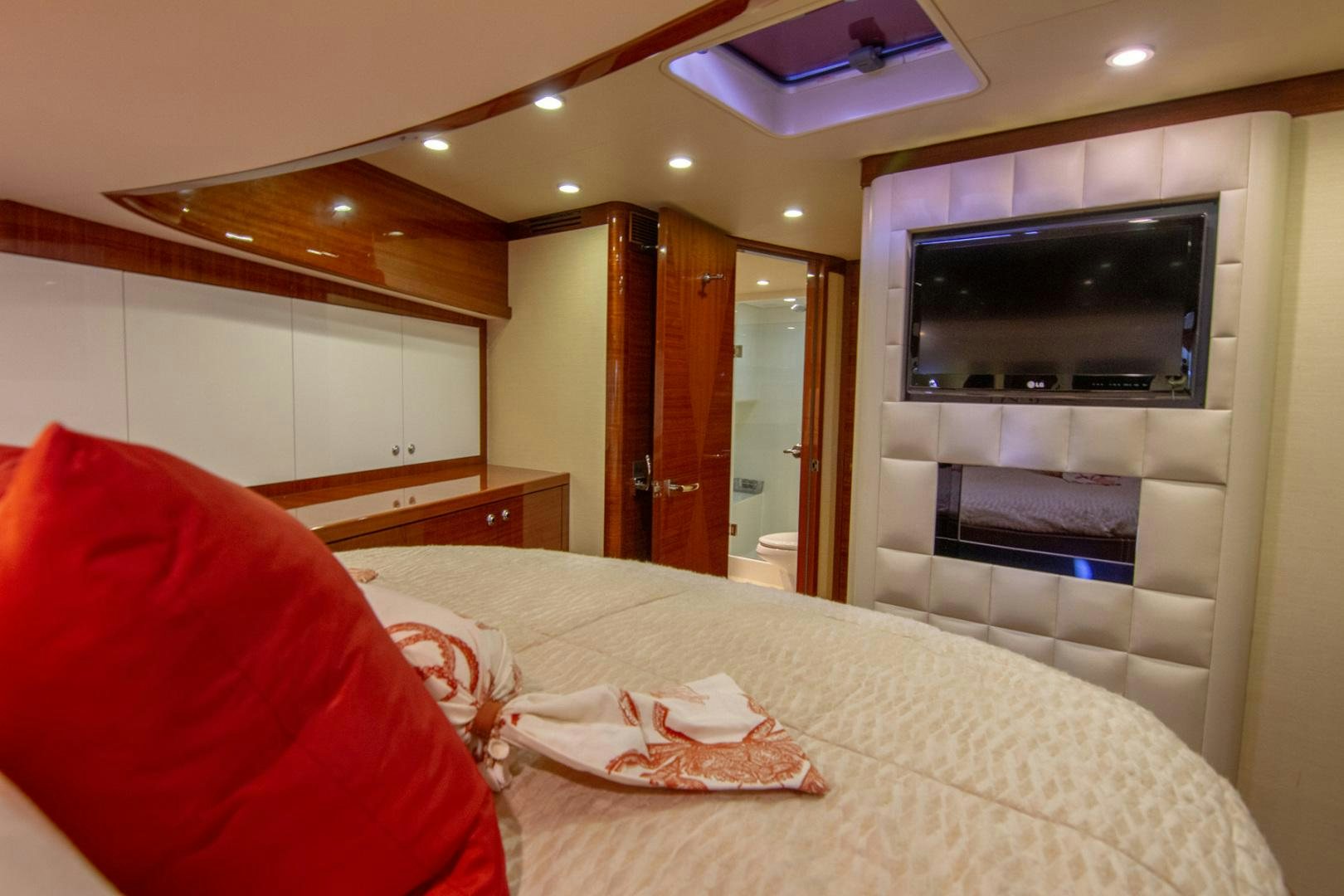 a hotel room with a tv and bed aboard BRAVO Yacht for Sale