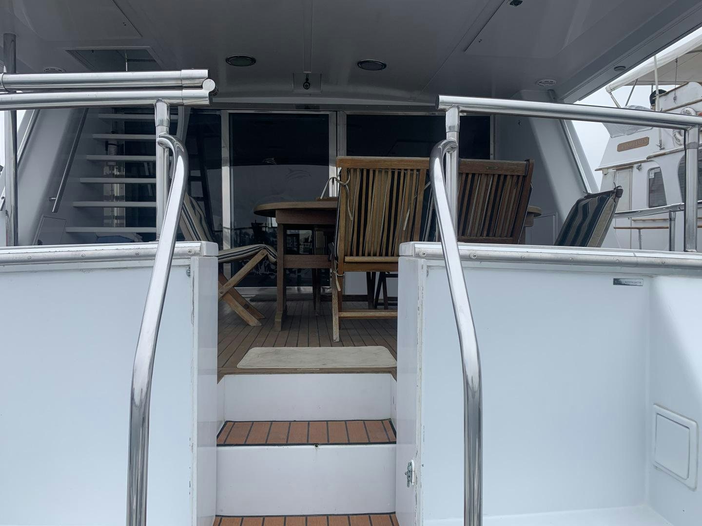 a room with a table and chairs aboard REHAB Yacht for Sale
