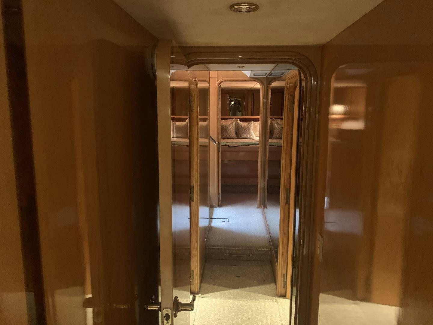 a person sitting in a chair in a room with a mirror aboard REHAB Yacht for Sale