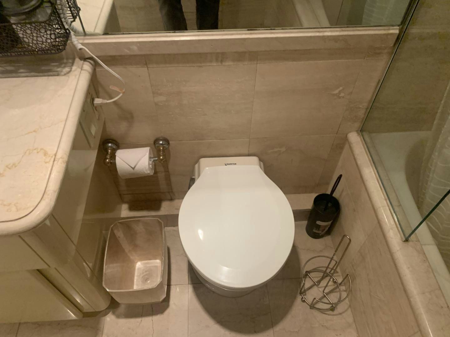 a toilet sits in a bathroom aboard REHAB Yacht for Sale