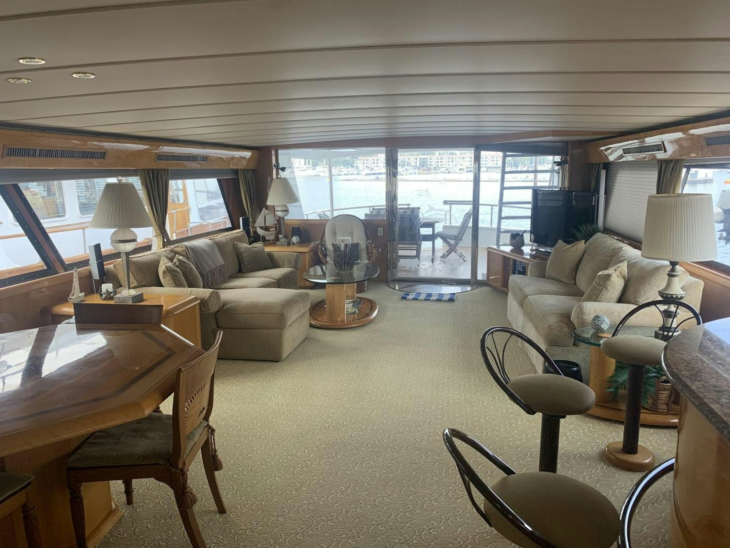 a living room with a large window aboard REHAB Yacht for Sale