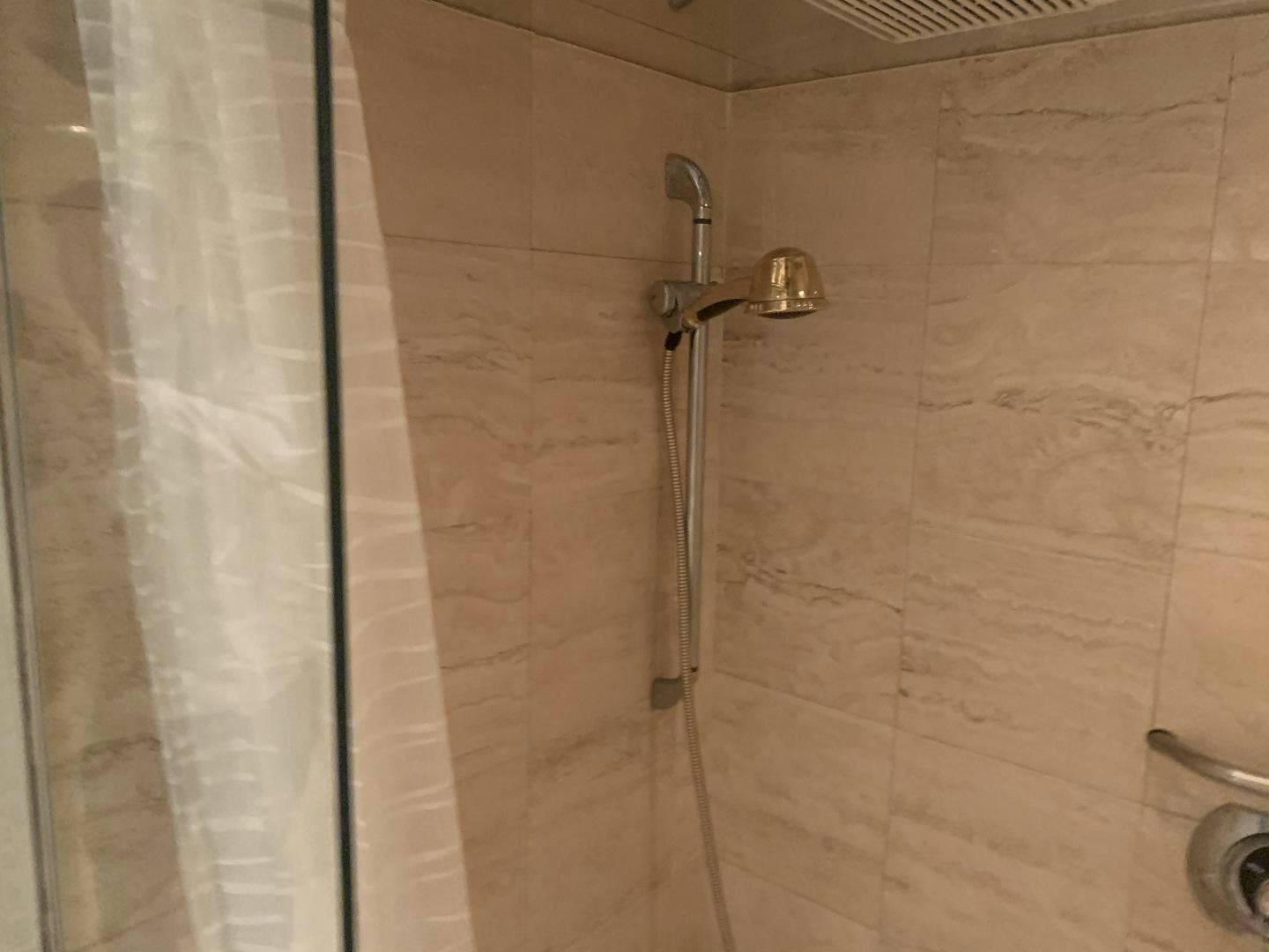 a shower with a tile wall aboard REHAB Yacht for Sale