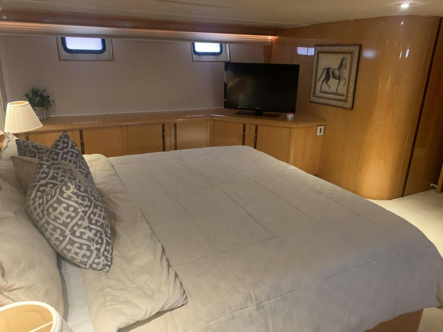 a bed with pillows aboard REHAB Yacht for Sale