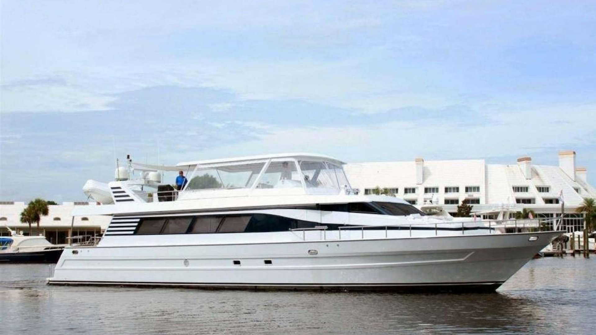 a white yacht in the water aboard REHAB Yacht for Sale