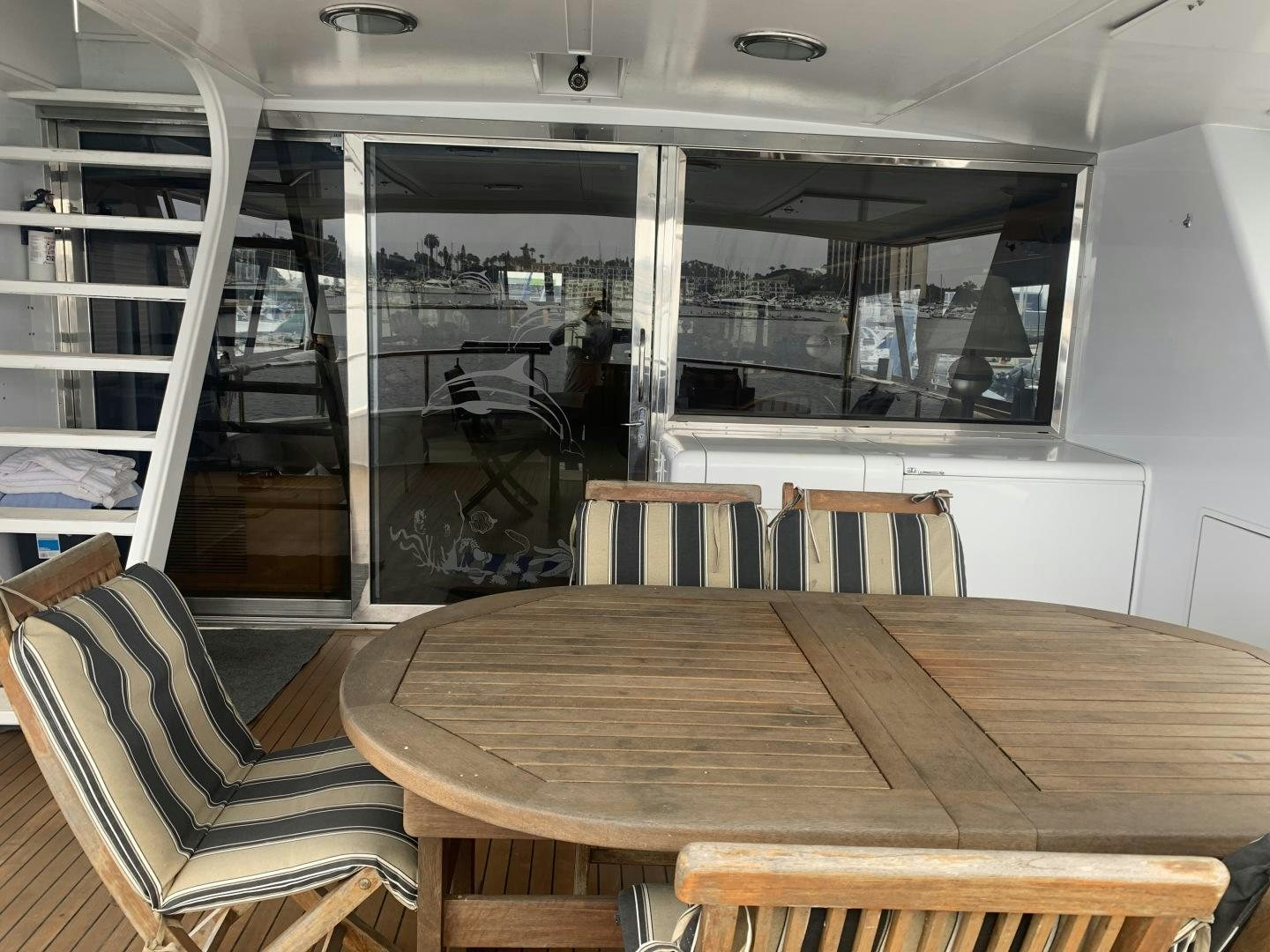 a table and chairs in a room aboard REHAB Yacht for Sale
