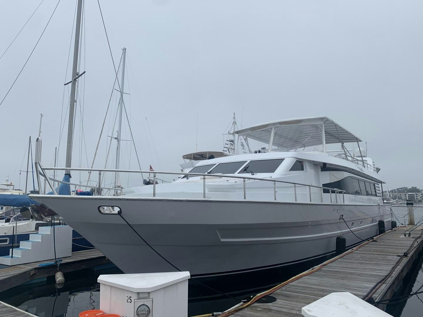 a boat docked at a pier aboard REHAB Yacht for Sale