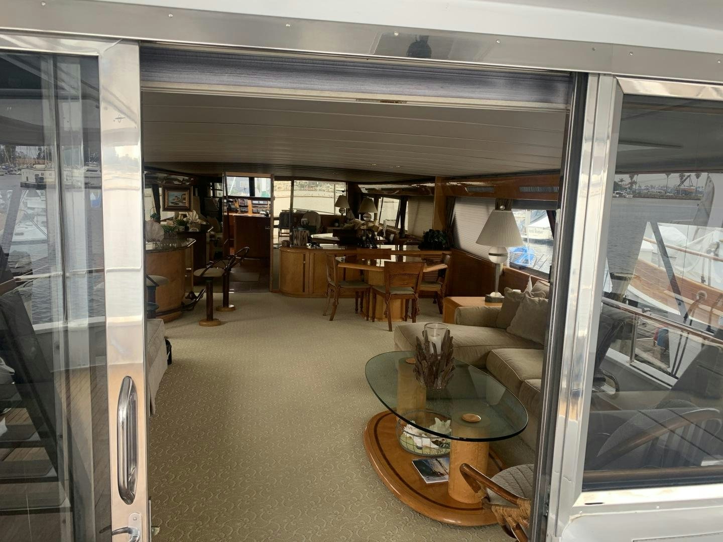 a room with a table and chairs aboard REHAB Yacht for Sale
