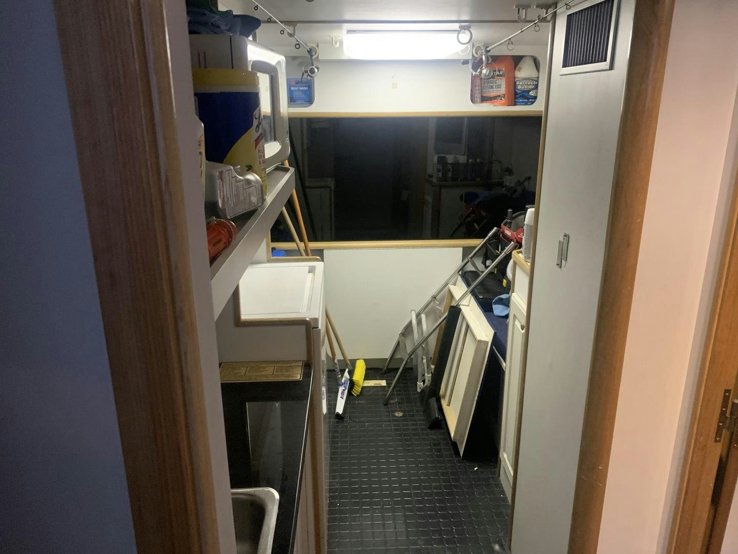 a hallway with a few cabinets and shelves aboard REHAB Yacht for Sale