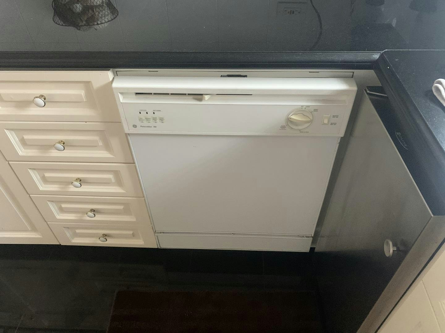 a white washer and dryer aboard REHAB Yacht for Sale