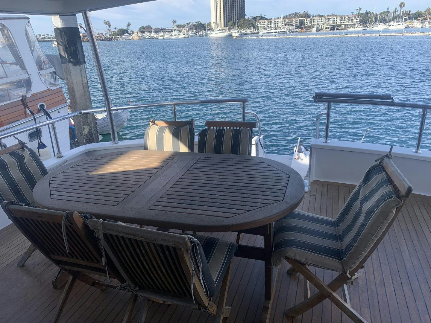 a table and chairs on a boat aboard REHAB Yacht for Sale