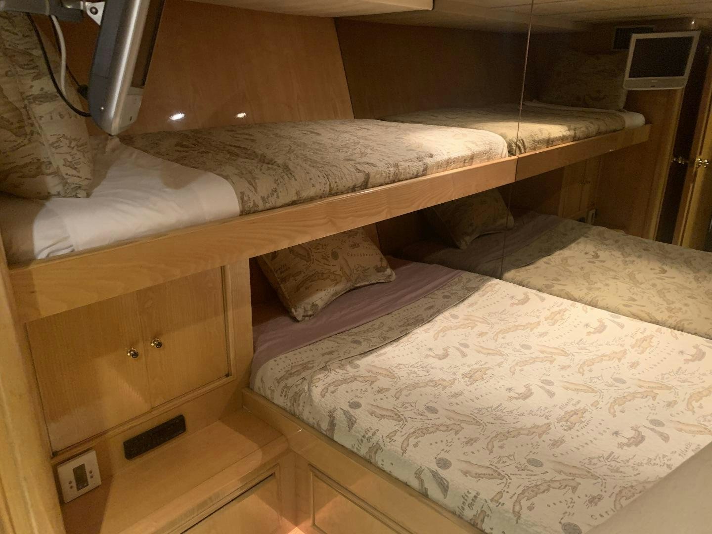 a couple of beds in a room aboard REHAB Yacht for Sale