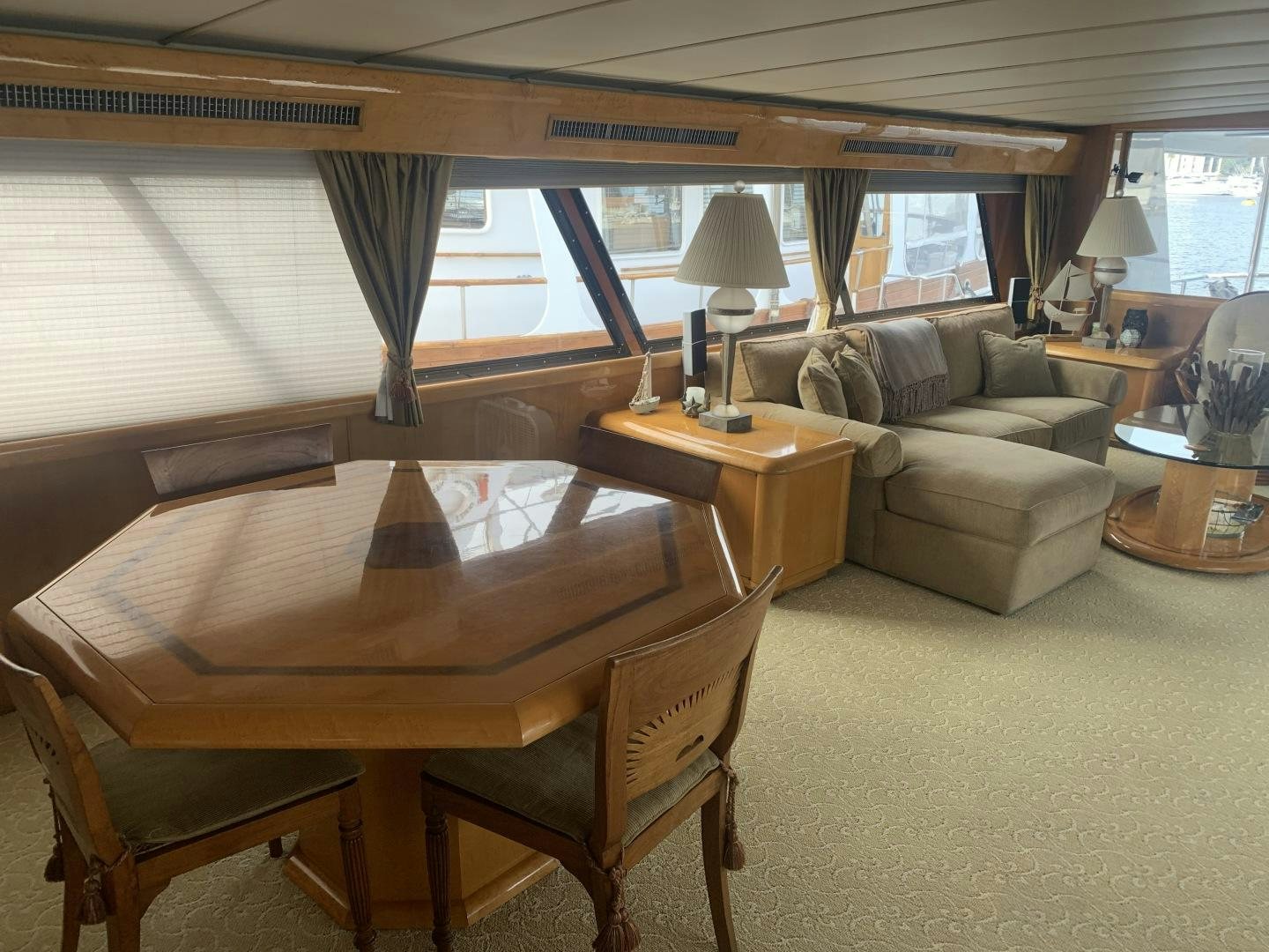 a living room with a couch and a table aboard REHAB Yacht for Sale