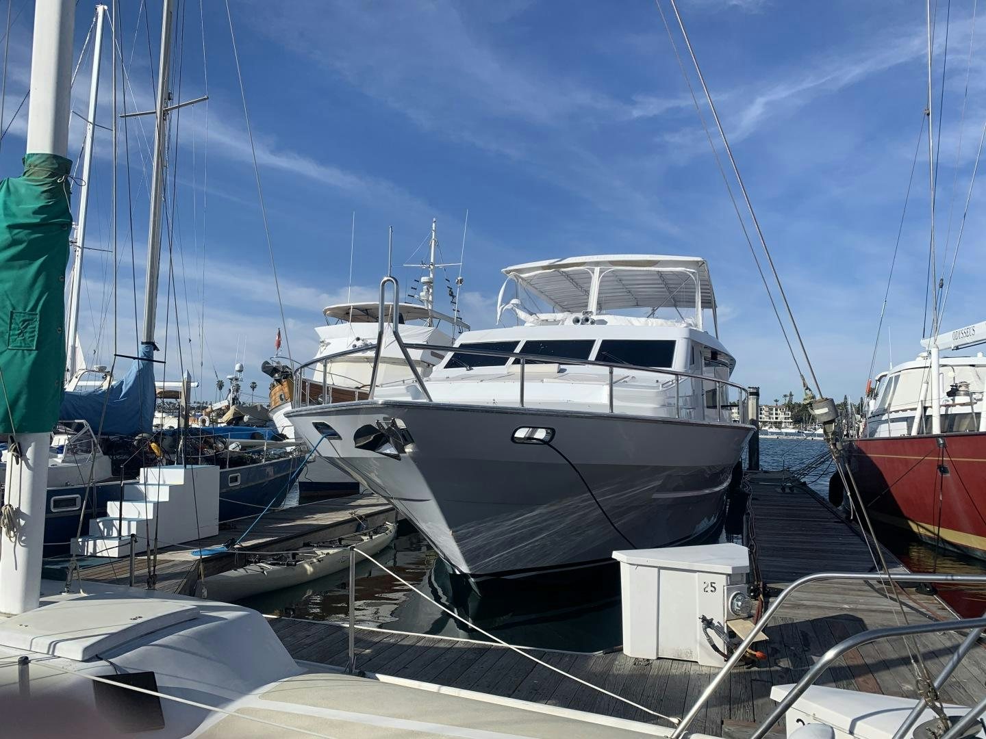 a boat docked at a pier aboard REHAB Yacht for Sale