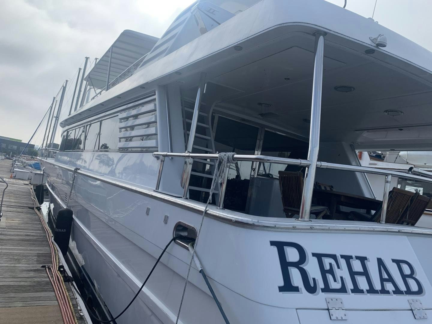 a large white boat aboard REHAB Yacht for Sale