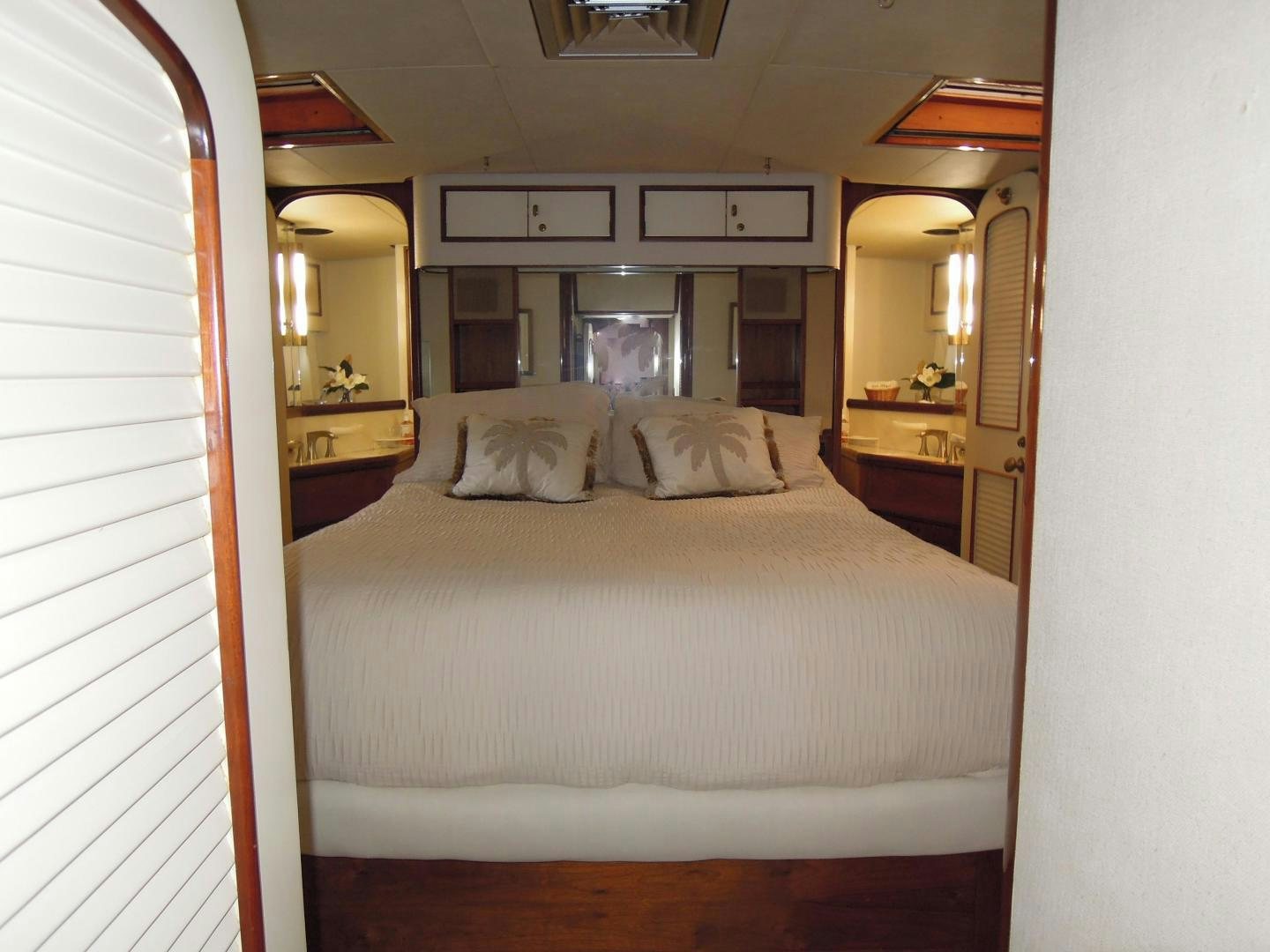 a bed with a white sheet aboard SEA ANGEL Yacht for Sale