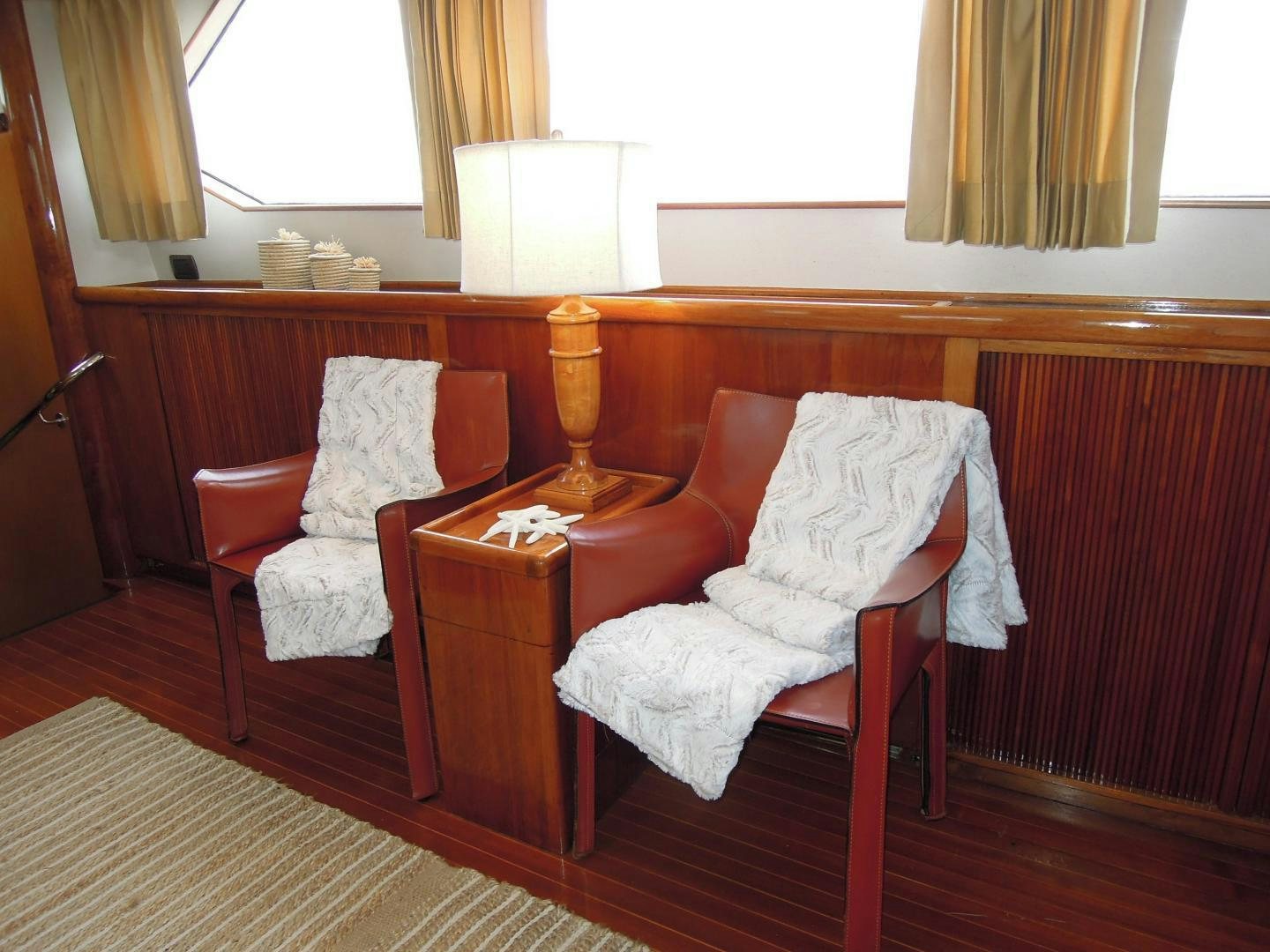 a couple of chairs in a room aboard SEA ANGEL Yacht for Sale