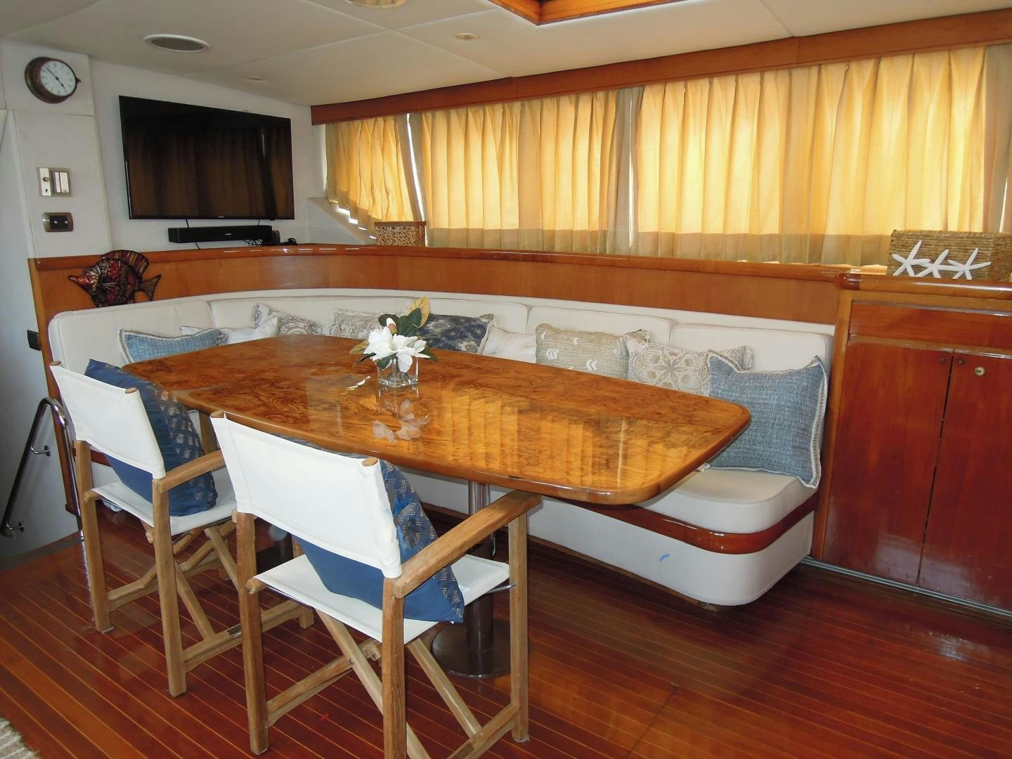 a kitchen with a table and chairs aboard SEA ANGEL Yacht for Sale