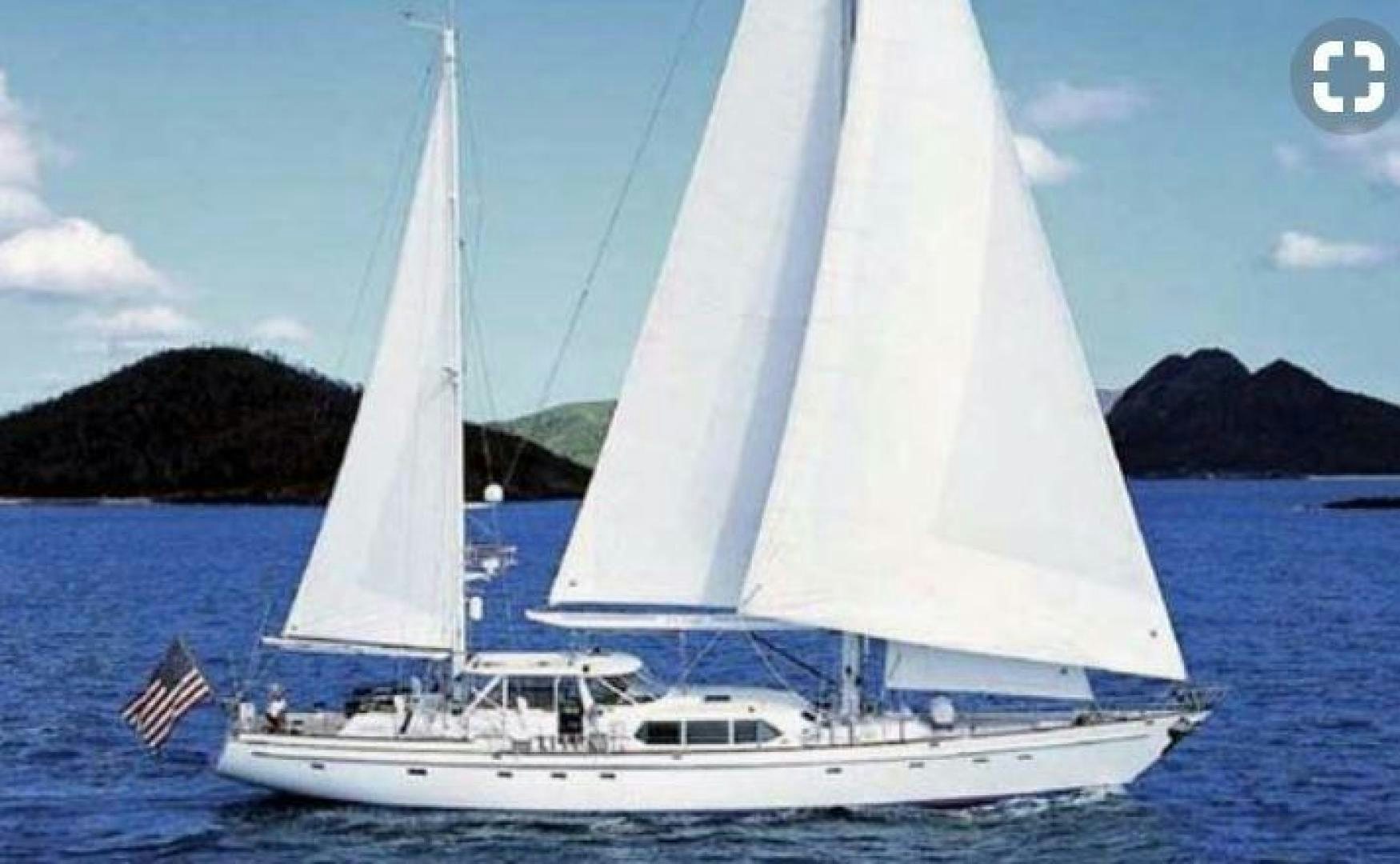 a white sailboat in the water aboard SEA ANGEL Yacht for Sale