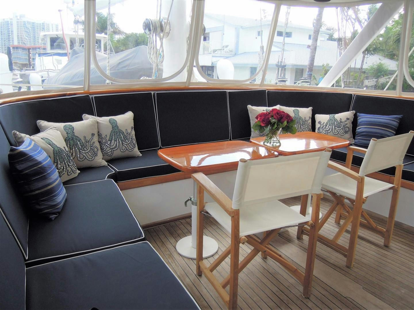 a room with a couch and a table and chairs aboard SEA ANGEL Yacht for Sale