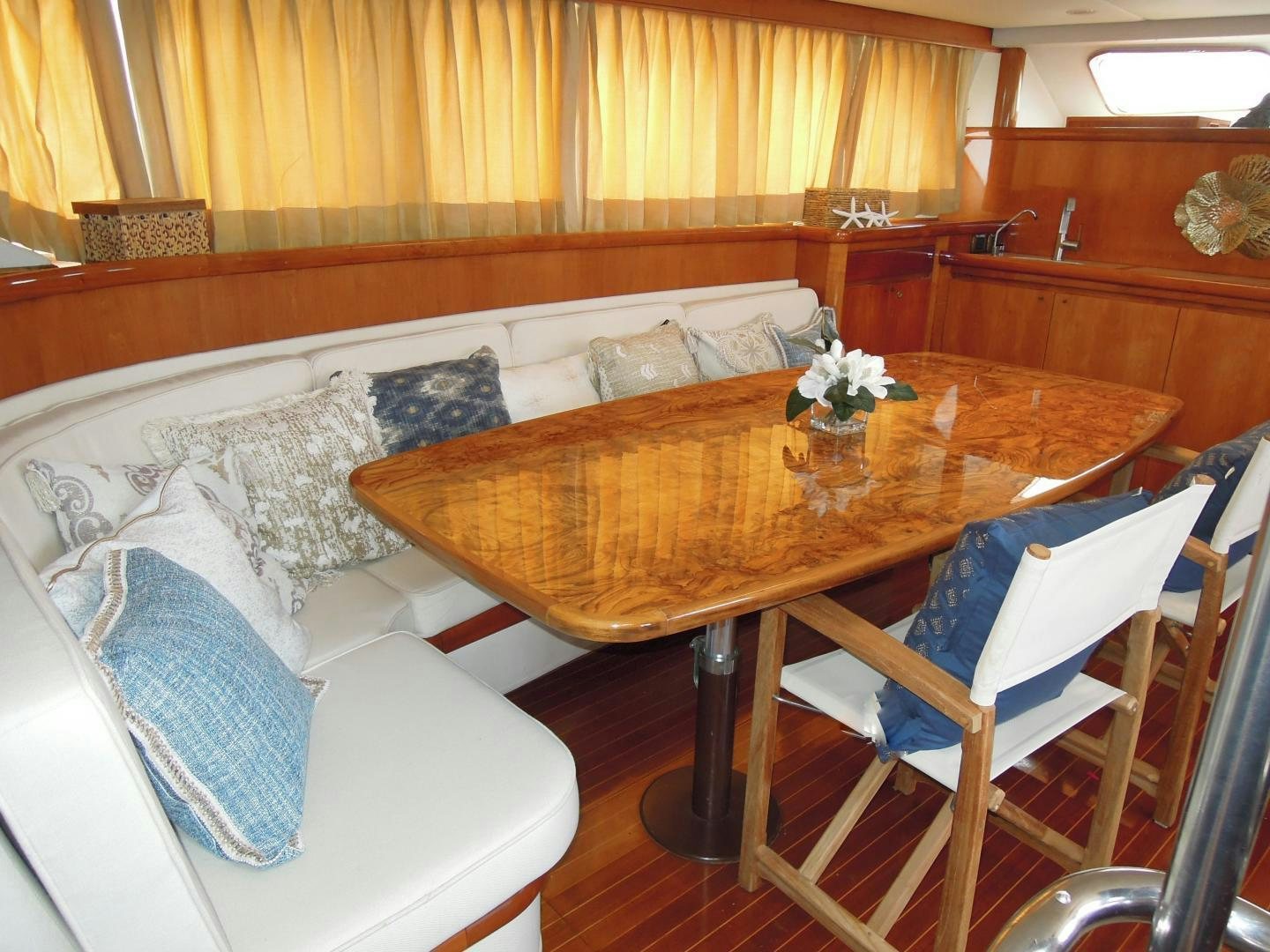 a room with a table and couch aboard SEA ANGEL Yacht for Sale