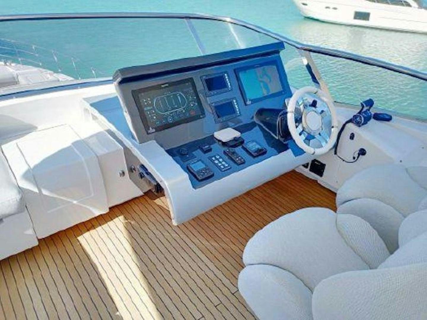 a white car with a screen aboard NOMAD Yacht for Sale