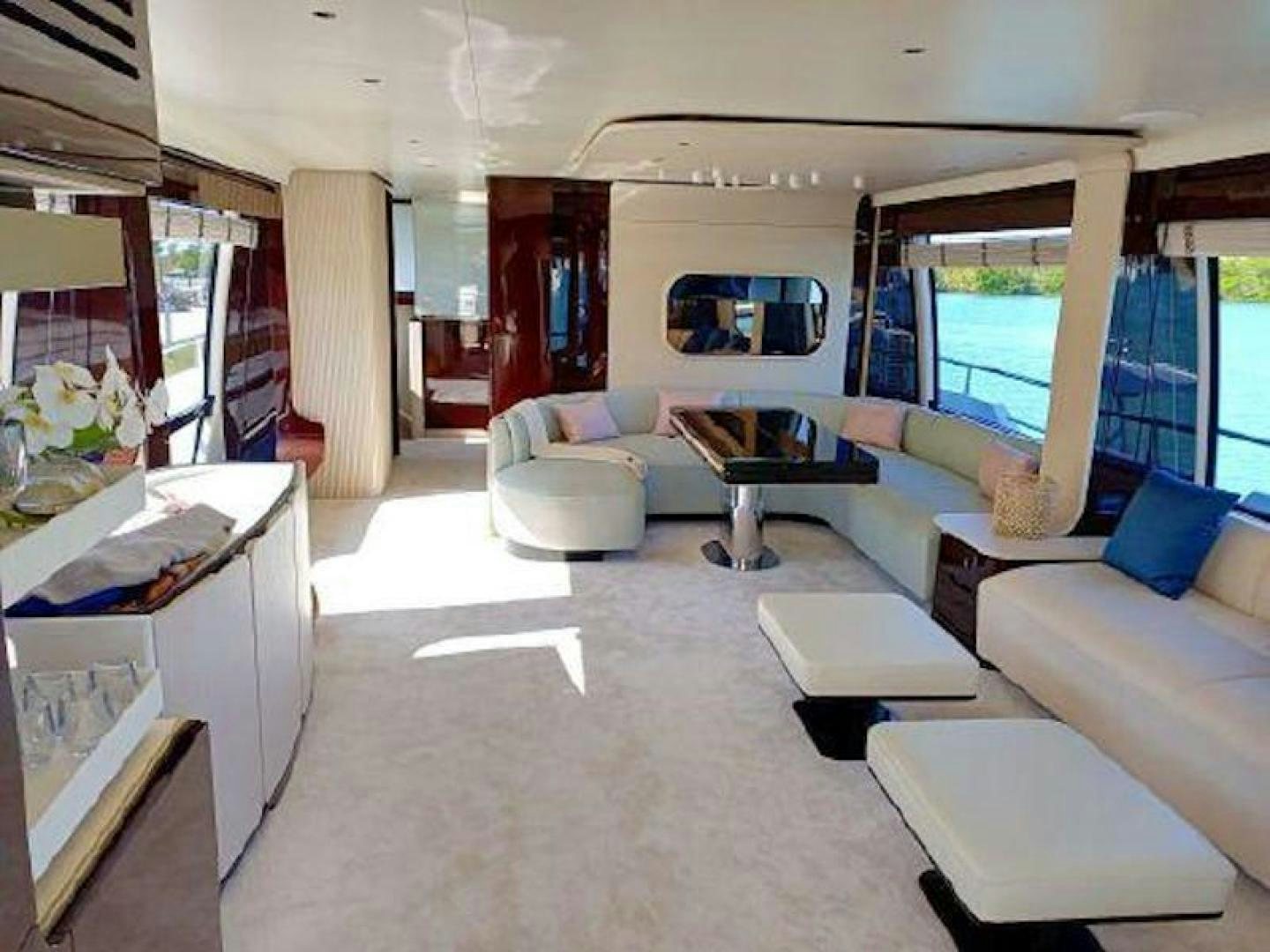 a living room with a large window aboard NOMAD Yacht for Sale