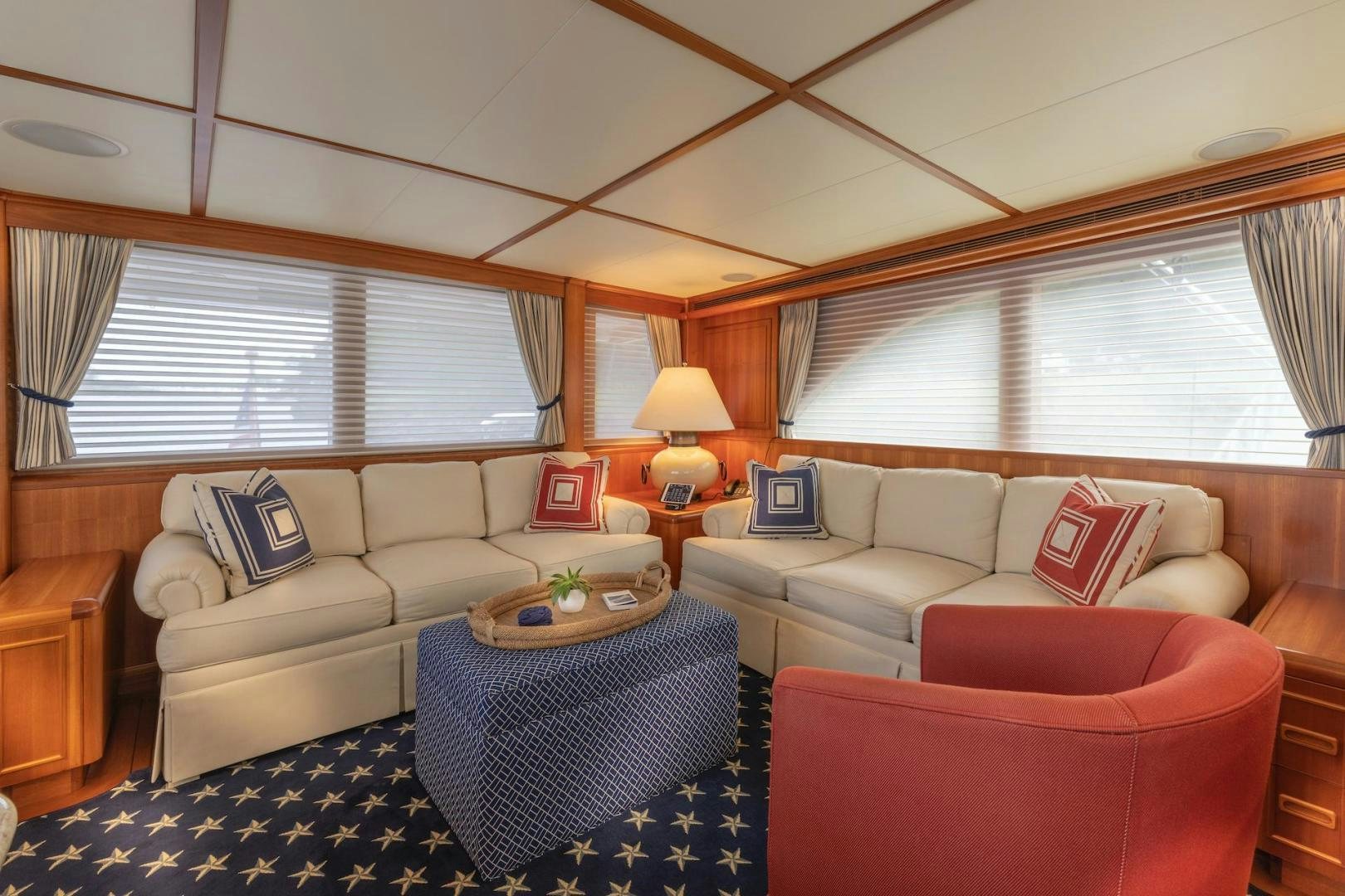 a living room with a couch and a table aboard CATCH Yacht for Sale