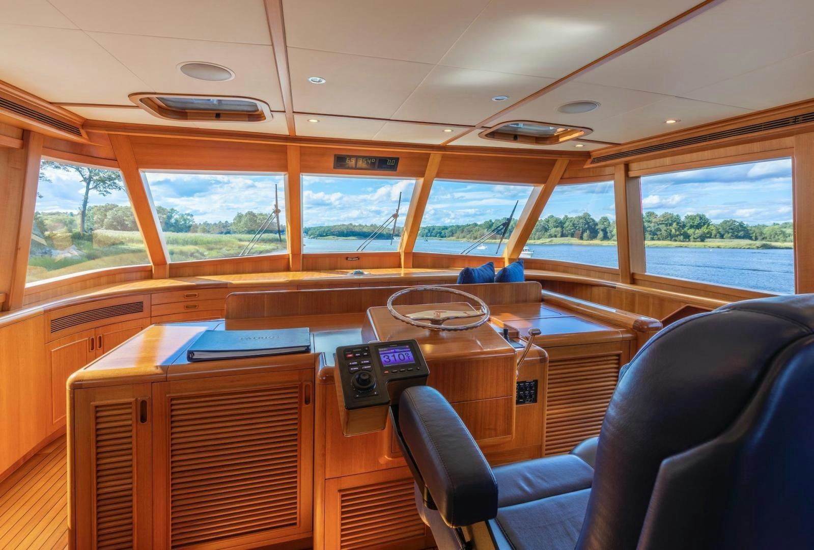 inside of a vehicle with a desk and a chair aboard CATCH Yacht for Sale