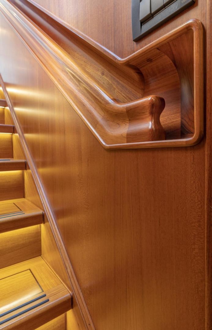 a wooden shelf with books aboard CATCH Yacht for Sale