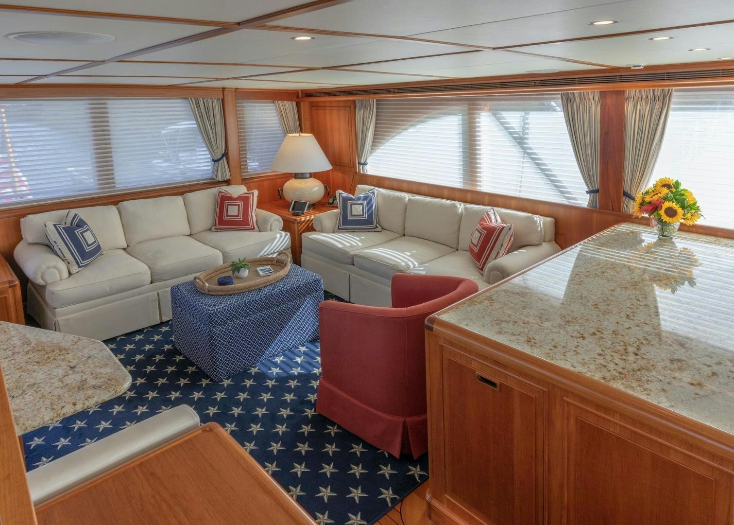 a living room with a couch and a table aboard CATCH Yacht for Sale