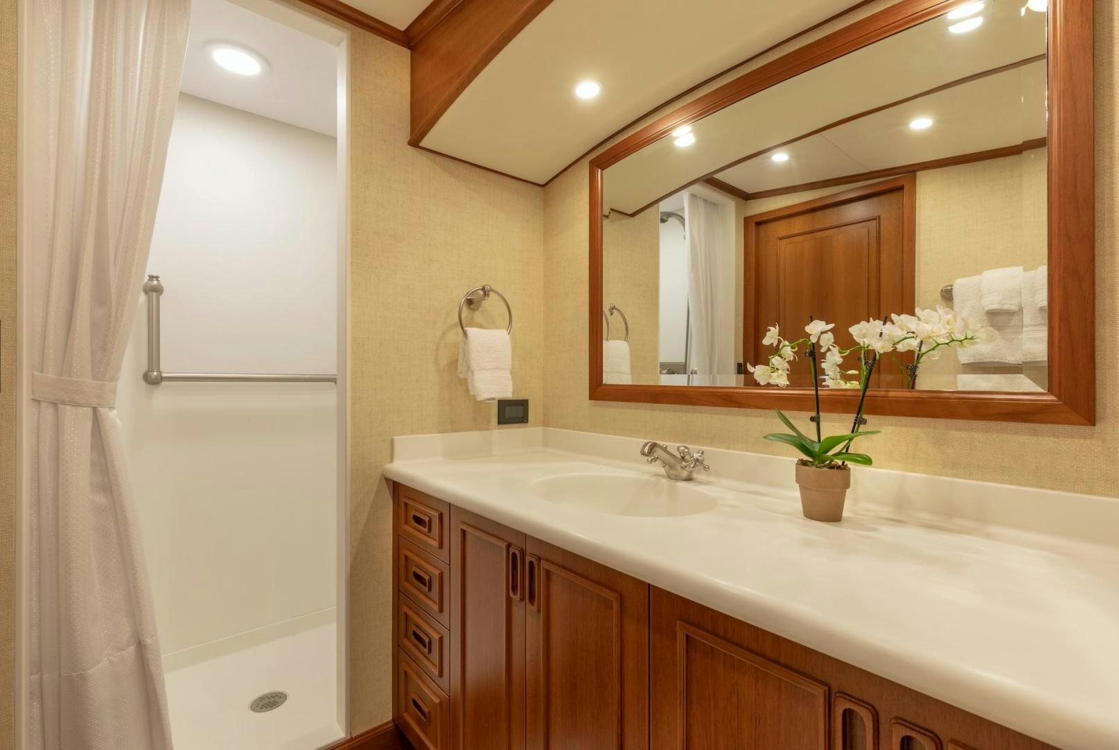 a bathroom with a large mirror aboard CATCH Yacht for Sale