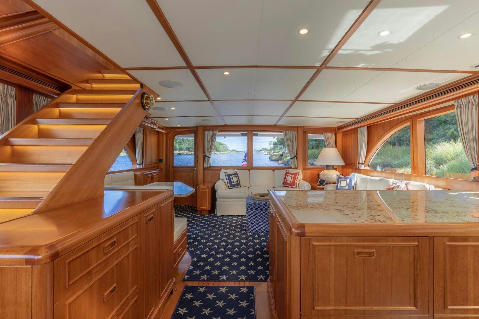 a room with wooden furniture aboard CATCH Yacht for Sale