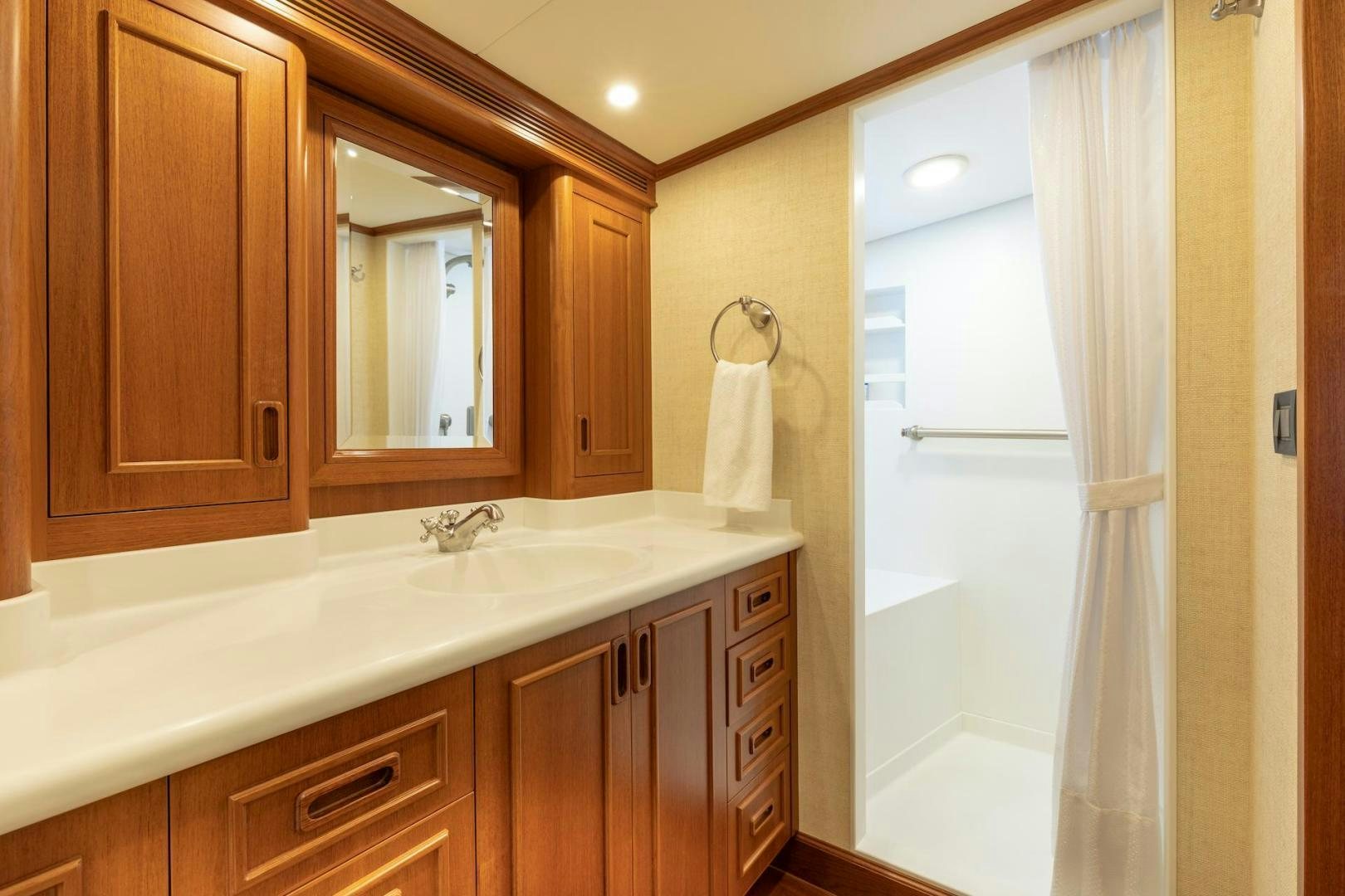 a bathroom with a large mirror aboard CATCH Yacht for Sale