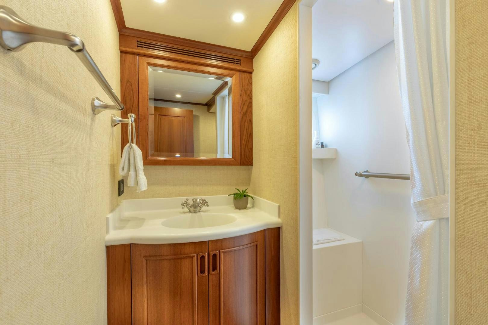 a bathroom with a sink and mirror aboard CATCH Yacht for Sale