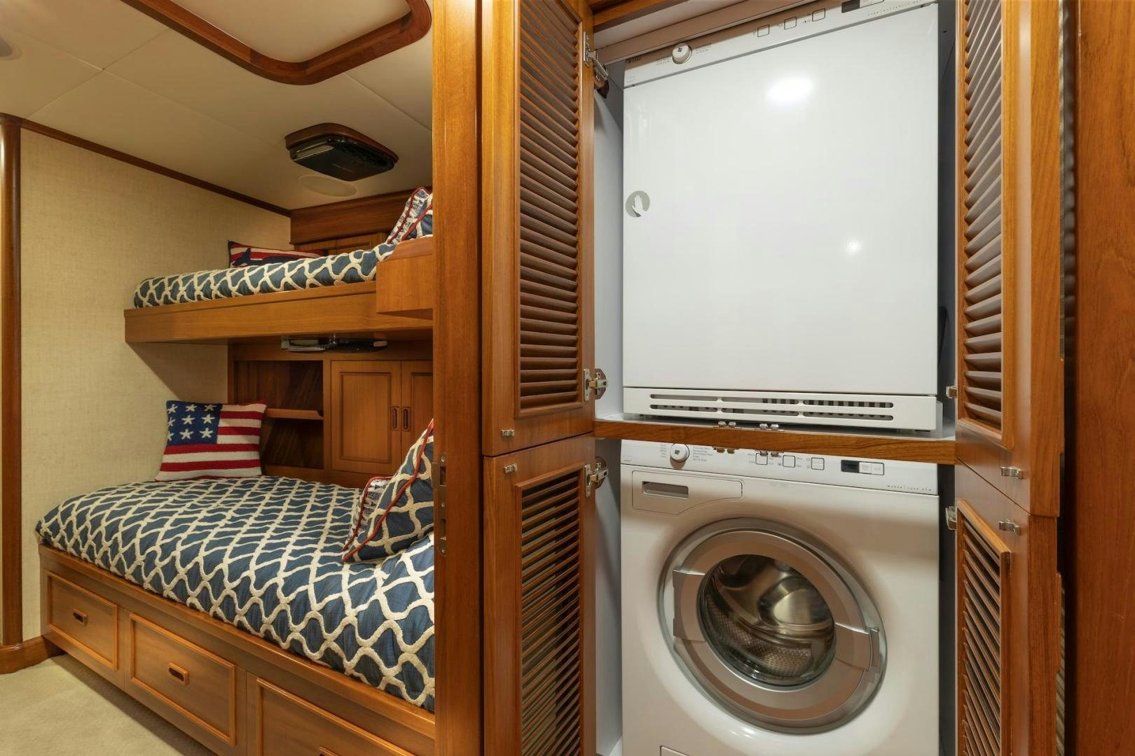a room with a bed and a closet aboard CATCH Yacht for Sale