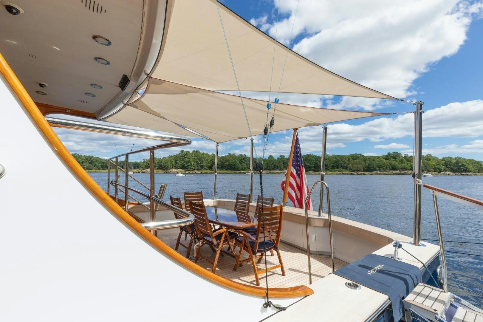 a boat with a flag on the front aboard CATCH Yacht for Sale