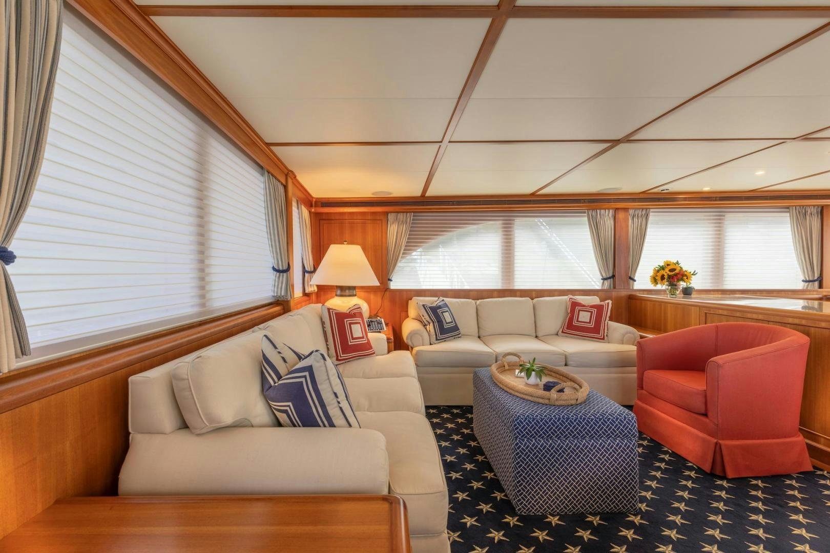 a living room with a couch and a table aboard CATCH Yacht for Sale