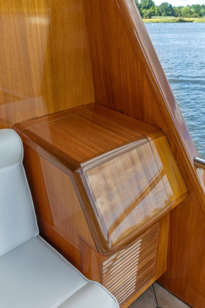 a wood shelf with a wood surface aboard CATCH Yacht for Sale