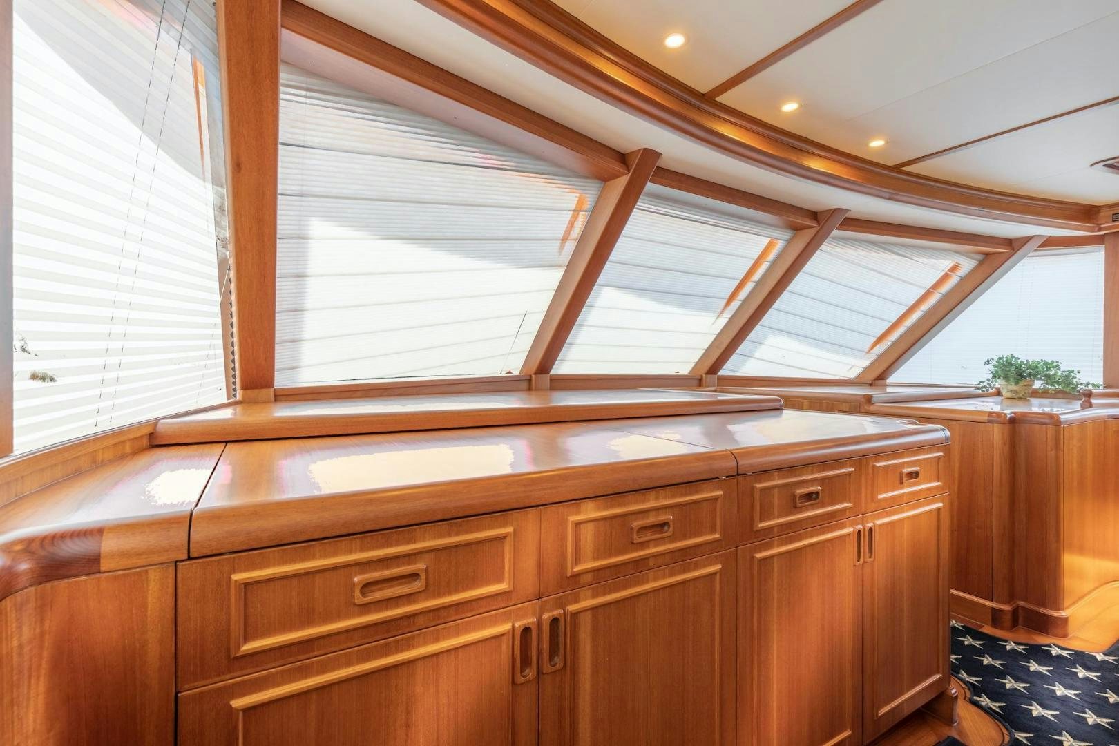 a room with wooden cabinets aboard CATCH Yacht for Sale