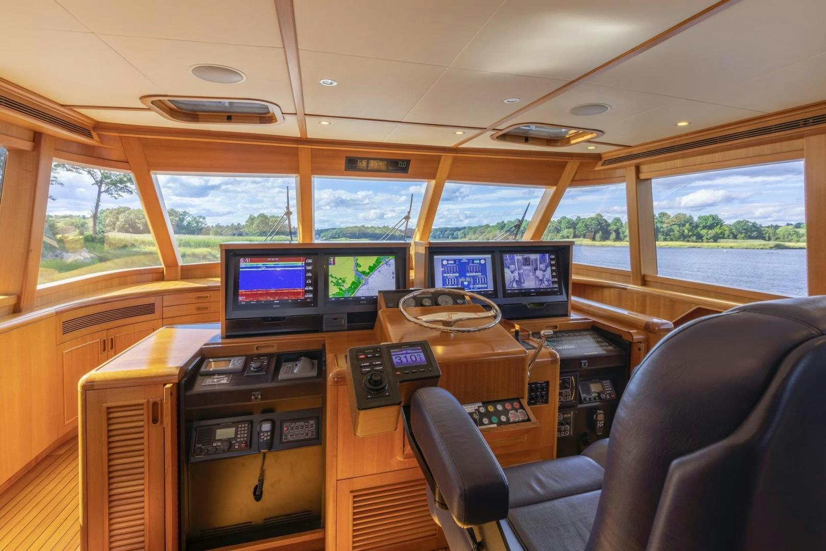 a room with computers and monitors aboard CATCH Yacht for Sale