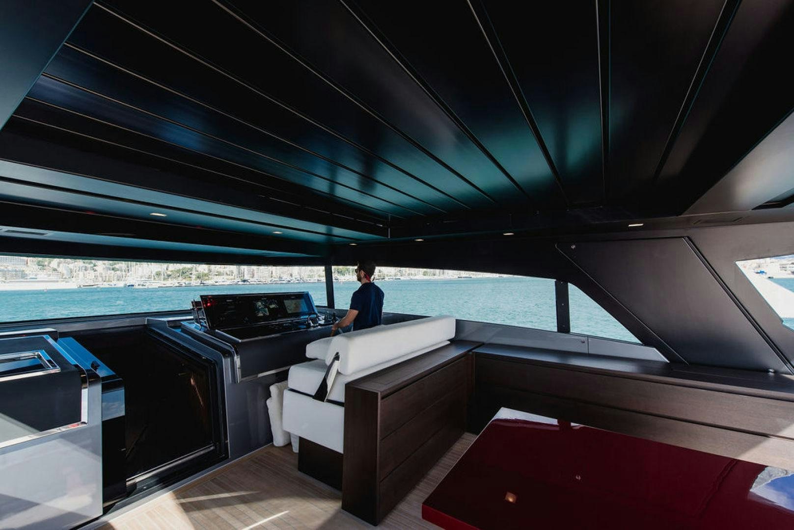 a person sitting at a table aboard ZAZZAZU II Yacht for Sale