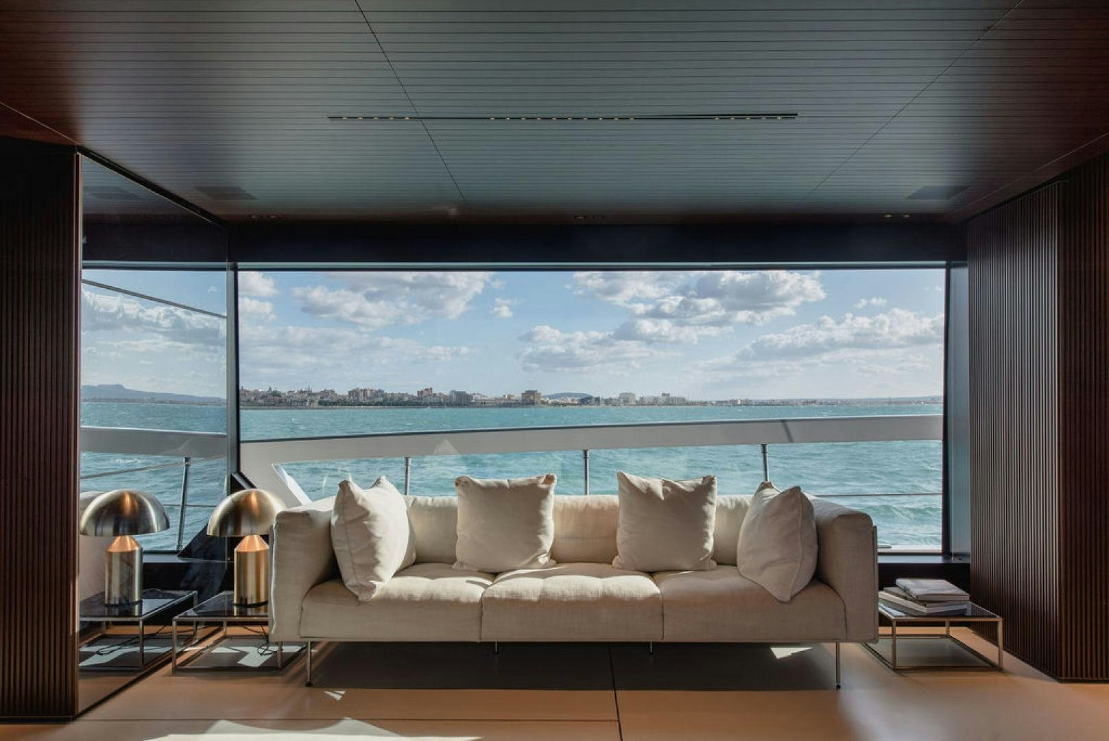 a large white couch in a room aboard ZAZZAZU II Yacht for Sale