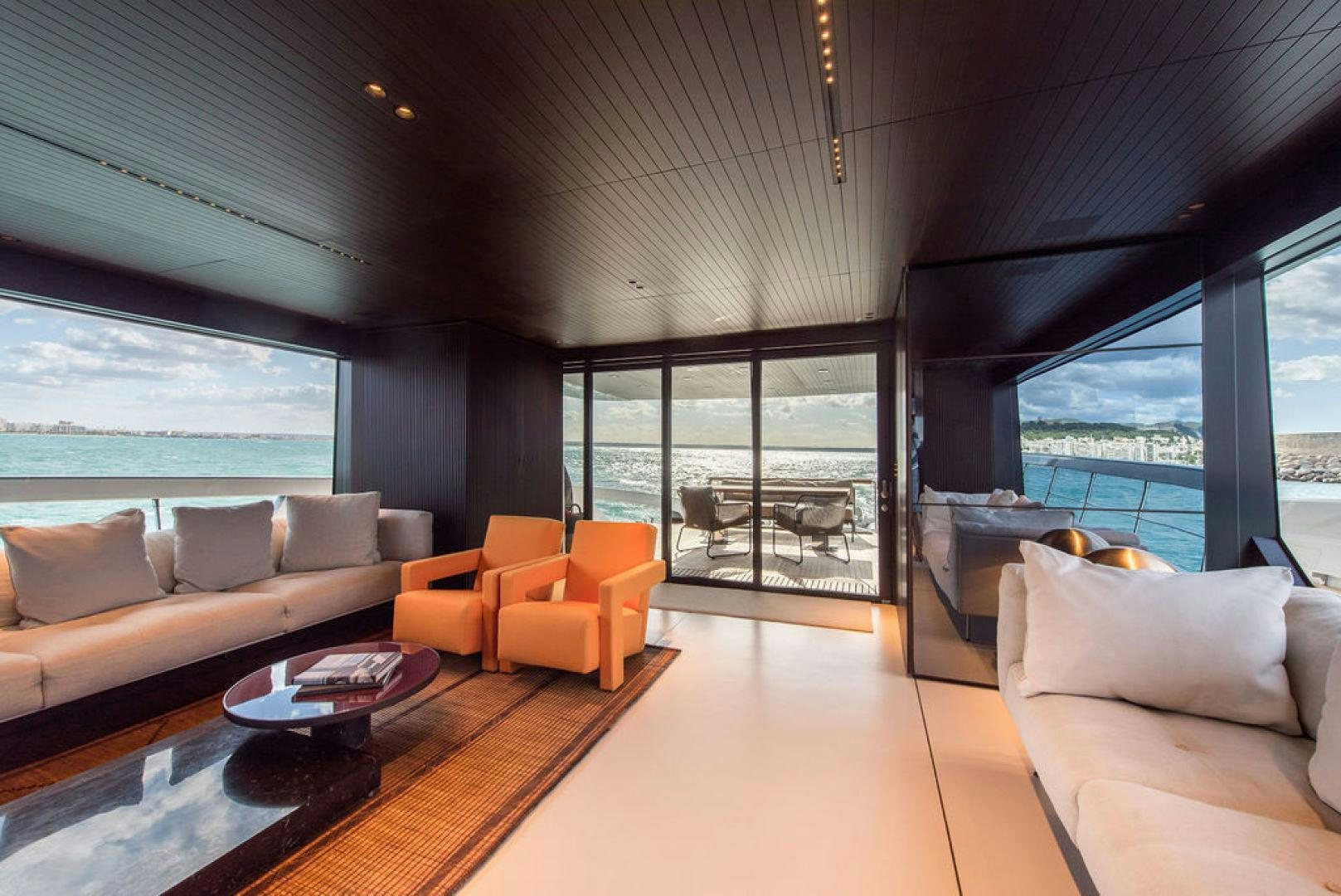 a living room with a large window aboard ZAZZAZU II Yacht for Sale