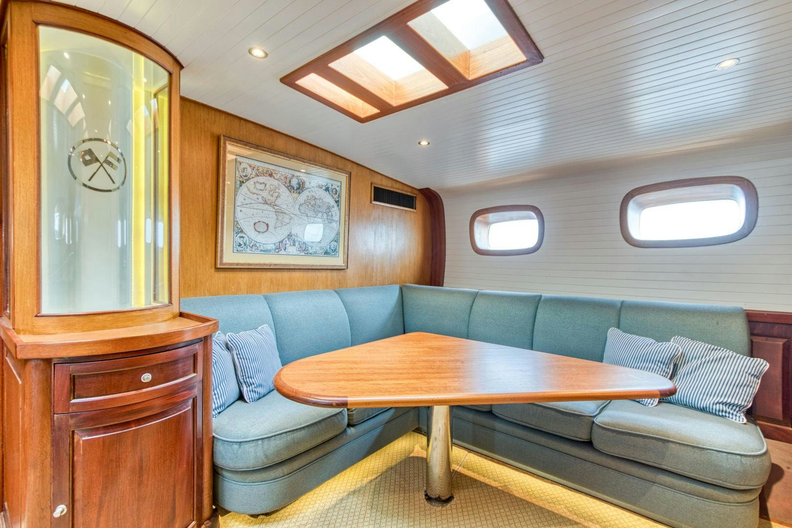 a living room with a couch and a table aboard ARIA Yacht for Sale