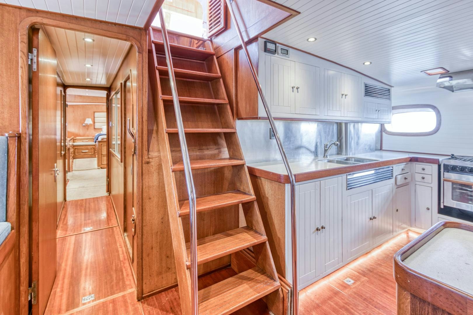 a wooden staircase in a kitchen aboard ARIA Yacht for Sale